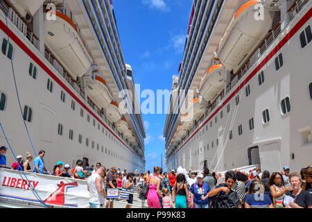 Grand Turk, Turks and Caicos Islands - April 03 2014: Close up on Carnival Liberty and Carnival Victory Cruise Ships docked side by side. Stock Photo