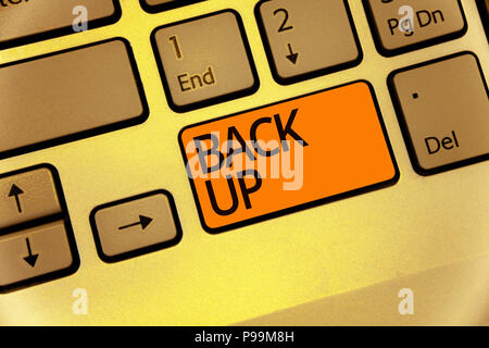 Word writing text Back Up. Business concept for saving important data into internet cloud and restore them later Keyboard orange key Intention create  Stock Photo