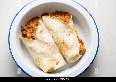 Beef burritos with chilli, rice, corn, beans wrapped in tortillas Stock Photo