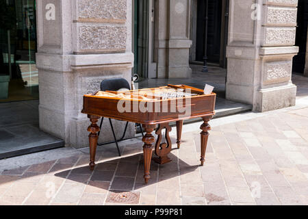 A hammered dulcimer, cymbalom, cymbalo, old swiss musical instrument, Lugano Switzerland, street performer, busker Stock Photo