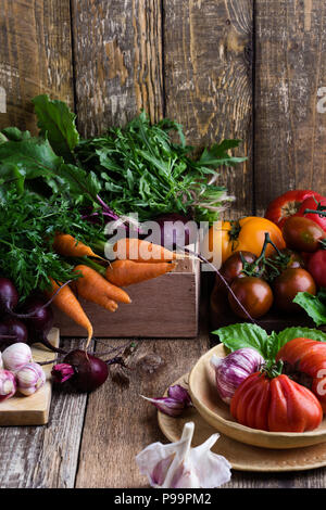 Fresh organic homegrown colofrul vegetables on wooden rustic table, harvest still life Stock Photo