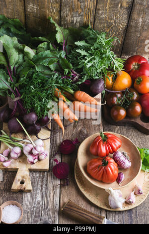 Fresh organic homegrown colofrul vegetables on wooden rustic table, harvest still life Stock Photo