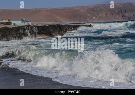 Beach of Arica Chile. Morro de Arica, Chile. Arica is a port city in northern Chile known for its ideal beaches for surfing. Stock Photo