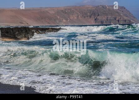 Beach of Arica Chile. Morro de Arica, Chile. Arica is a port city in northern Chile known for its ideal beaches for surfing. Stock Photo