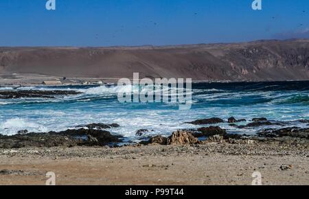 Beach of Arica Chile. Morro de Arica, Chile. Arica is a port city in northern Chile known for its ideal beaches for surfing. Stock Photo