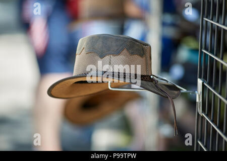 Prescott, Arizona, USA - June 30, 2018: A handmade hat with leather tassle on a display rack at the 4th of July festival in downtown Prescott Stock Photo