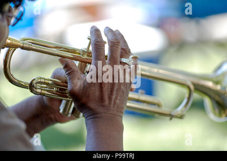 Prescott, Arizona, USA - June 30, 2018: A street muscian playing a trumpet at the 4th of July festival in downtown Prescott Stock Photo