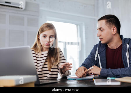Serious students working on a project Stock Photo