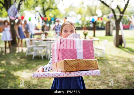 Family celebration or a garden party outside in the backyard. Stock Photo