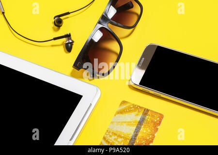 gadgets and accessories on a yellow background Stock Photo