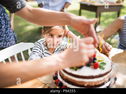 Family celebration or a garden party outside in the backyard. Stock Photo