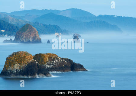 Haystack rock and Cannon Beach, Oregon. A long exposure shot from Ecola Head. Stock Photo