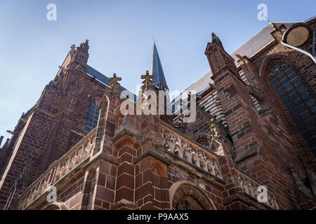 Looking up at architectural details of the Church of Our Lady in Aarschot, Belgium on a sunny day. Stock Photo