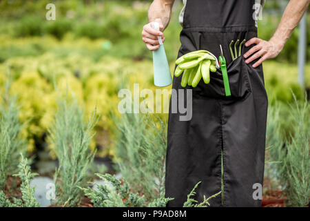 Tools for gardening in the pocket of the gardener Stock Photo