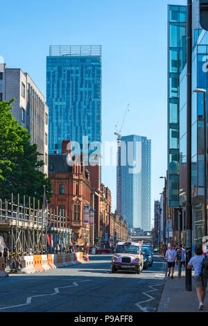 The Beetham Tower and one of the Deansgate Square apartment blocks (under construction), from Deansgate, Manchester, England, UK Stock Photo