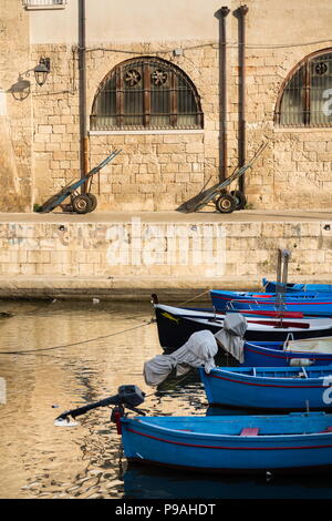 Traditional fishing boats in Monopoli port, Apulia, Bari province, Italy Stock Photo