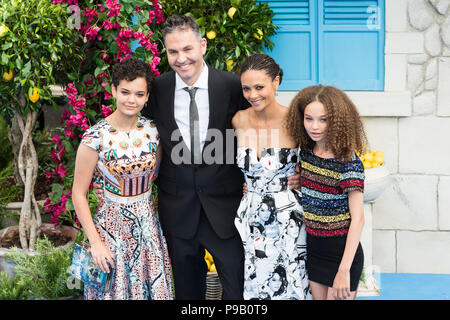London, UK. 16th July 2018. Ol Parker (CL) and Thandie Newton (CR) with family arrive for the world film premiere of 'Mamma Mia! Here We Go Again' at Eventim Apollo, Hammersmith in London. Credit: Wiktor Szymanowicz/Alamy Live News Stock Photo