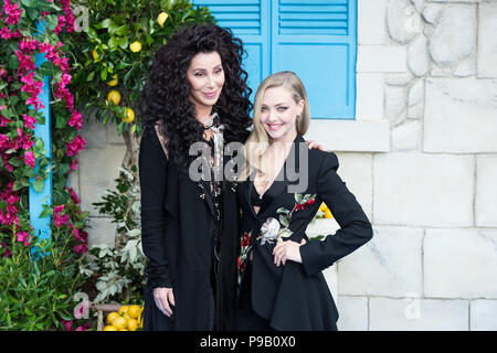 London, UK. 16th July 2018. Cher and Amanda Seyfried arrive for the world film premiere of 'Mamma Mia! Here We Go Again' at Eventim Apollo, Hammersmith in London. Credit: Wiktor Szymanowicz/Alamy Live News Stock Photo