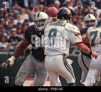 Oakland, California, USA. 10th Dec, 1995. Oakland Raiders vs. Pittsburgh  Steelers at Oakland Alameda County Coliseum Sunday, December 10, 1995.  Steelers beat Raiders 29-10. Oakland Raiders defensive end Anthony Smith  (94) celebrates