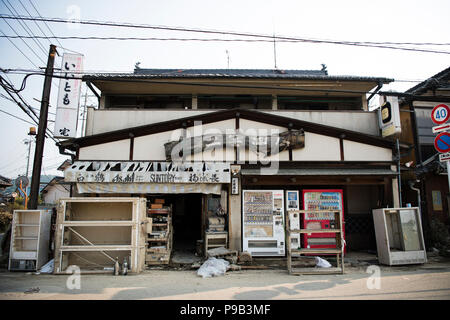 Okayama, Japan. 17th July 2018. A damaged liquor store in Mabicho, Kurashiki, Okayama Prefecture, Japan. More than 200 people died in floods and landslides caused by torrential rains more than a week ago. On Sunday, the government announced the weather event would be designated an extremely severe disaster, freeing up recovery funds for the affected areas. Cleanup and recovery efforts have been hampered by extreme heat. Credit: Aflo Co. Ltd./Alamy Live News Stock Photo