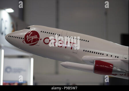 Farnborough, Hampshire, UK. 17 July, 2018. Busy second day of the biennial Farnborough International Trade Airshow FIA2018, open to Aerospace and Defence buyers and sellers. Virgin Orbit space launch aircraft on display at the UK’s Spaceport Cornwall stand. Credit: Malcolm Park/Alamy Live News. Stock Photo