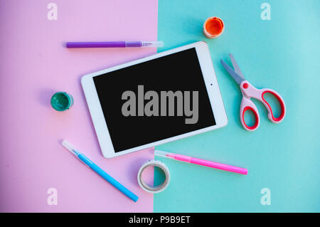 Back to school concept. School supplies on pink and blue background with text space. Stock Photo