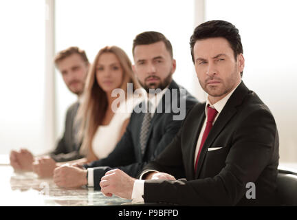 business group sitting at the negotiating table Stock Photo