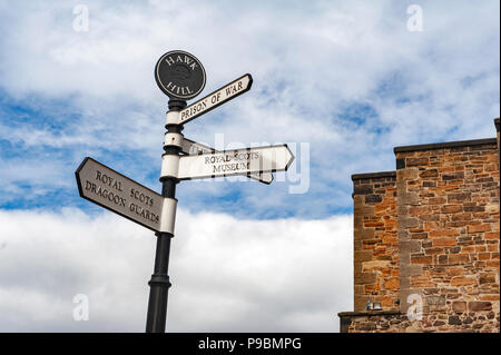 Direction signpost inside Edinburgh Castle, popular tourist attraction and landmark of Edinburgh, capital city of Scotland, UK Stock Photo