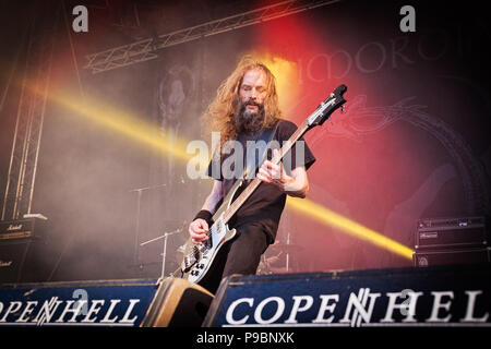 Irish extreme metal band Primordial performs at the 2015 Copenhell Metal    Festival. Here bass player Pól MacAmhlaigh Stock Photo