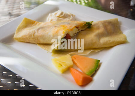 Crepe Stuffed with Eggs, bacon, spinach and cheese Stock Photo