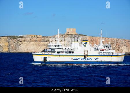 Ta Pinu Gozo Channel Line ferry with views towards Comino to the rear during the Springtime, Malta, Europe. Stock Photo