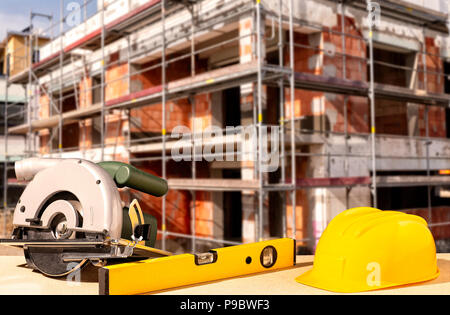 Helmet and tools with a shell in the background Stock Photo