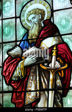 Saint Paul, holding a large sword and reading a book. Stock Photo