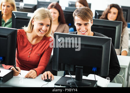 Students learning in computer lab Stock Photo