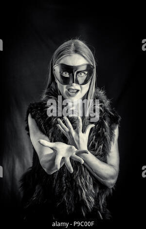 blond woman wearing black fur coat and fur cap Stock Photo - Alamy