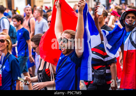 Paris, France. 15th July, 2018. Large crowds celebrate in the streets of Paris after France wins the 2018 FIFA World Cup Russia. Paris, France. Stock Photo