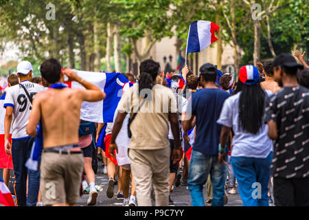 Paris, France. 15th July, 2018. Large crowds celebrate in the streets of Paris after France wins the 2018 FIFA World Cup Russia. Paris, France. Stock Photo