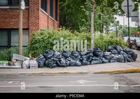 Big pile of black plastic garbage bags with trash stacked on the street trash  bags. on the street at utility workers strike day Stock Photo - Alamy