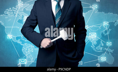 Businessman holding tool with global map graphic on the background Stock Photo