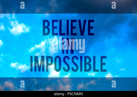 Handwriting text Believe In Impossible. Concept meaning You can do it everything is possible Work hard Multiline text desktop natural blue sky cloudy  Stock Photo