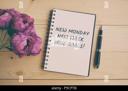 Inspirational and motivation life quote on note pad - New Monday, New week, new goals. Retro style. Stock Photo