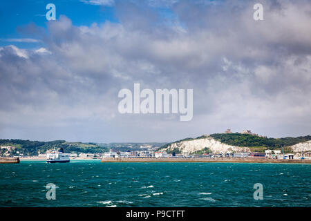 Car ferries, the harbour wall and Dover Castle above the ferry port of Dover, Kent, England, UK Stock Photo