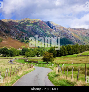 Small winding country road through the Langdale Valley in the Lake District National Park, Cumbria, England, UK Stock Photo