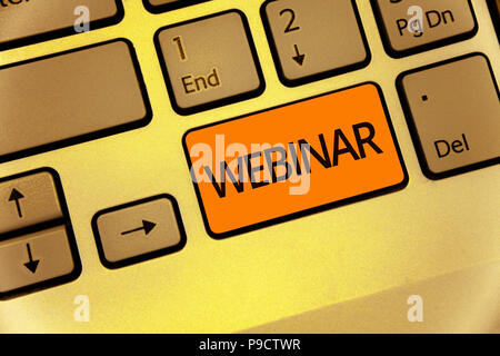 Word writing text Webinar. Business concept for defined as seminar conducted over the Internet Web conferencing Keyboard orange key Intention create c Stock Photo