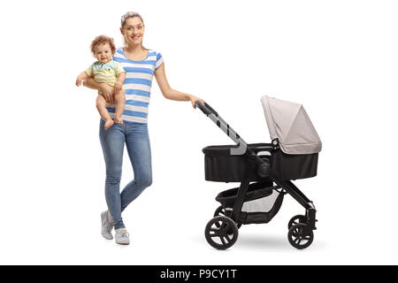 Full length portrait of a young mother with her baby and a stroller isolated on white background Stock Photo