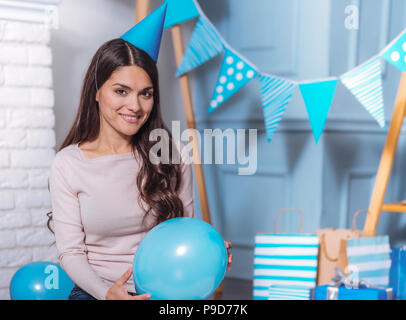 Cheerful girl having birthday party Stock Photo
