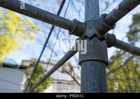 The centre column and arms of a Hills Hoist backyard clothes drying line in Australia Stock Photo