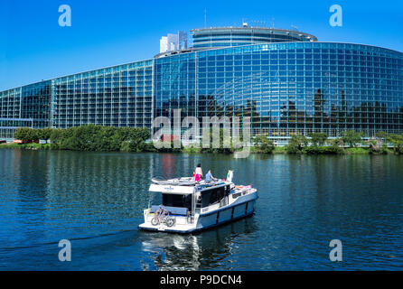 Strasbourg, pleasure boat cruising on Ill river, Louise Weiss building, EU, European Parliament, Alsace, France, Europe, Stock Photo