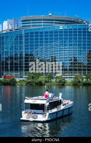 Strasbourg, pleasure boat cruising on Ill river, Louise Weiss building, European Parliament, Alsace, France, Europe, Stock Photo