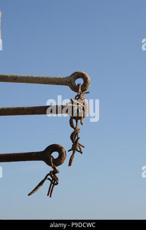 Broken barbed wire fence Stock Photo
